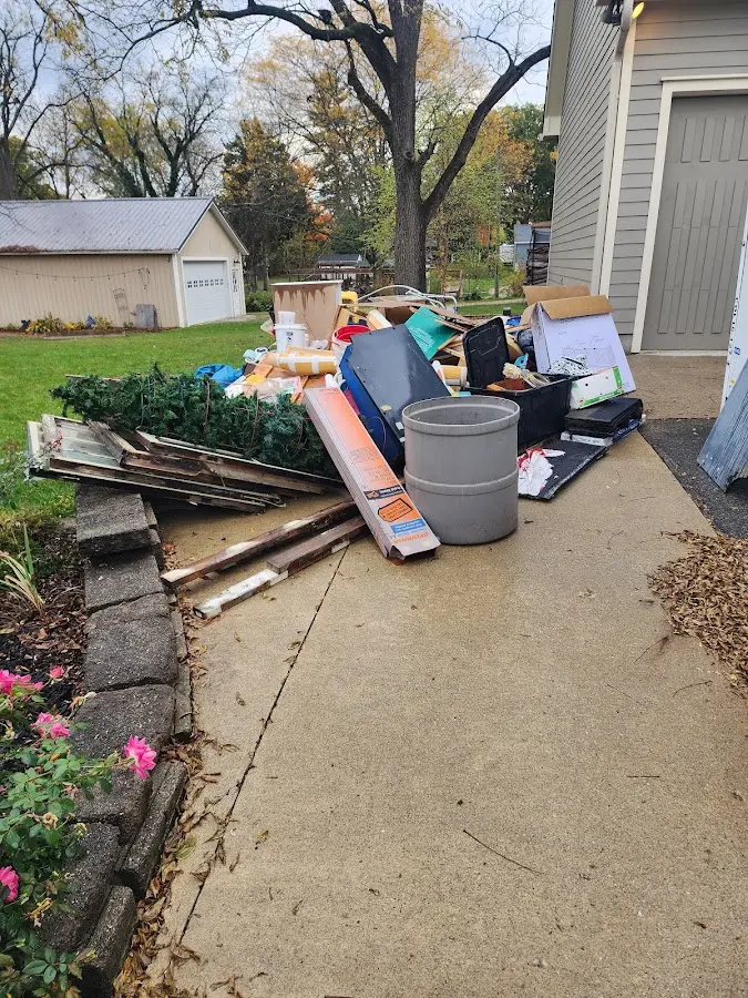 Dumpster being loaded with debris for Residential Dumpster Rental in Ossining